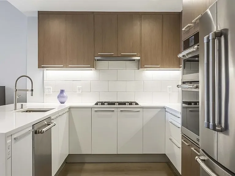 Kitchen from old listing - there are some items now like toaster/knives/drying rack - see other photo