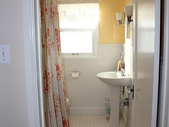 Upstairs bathroom with bathtub and shower