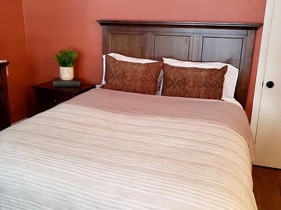 Walls are now painted yellow in this bedroom.