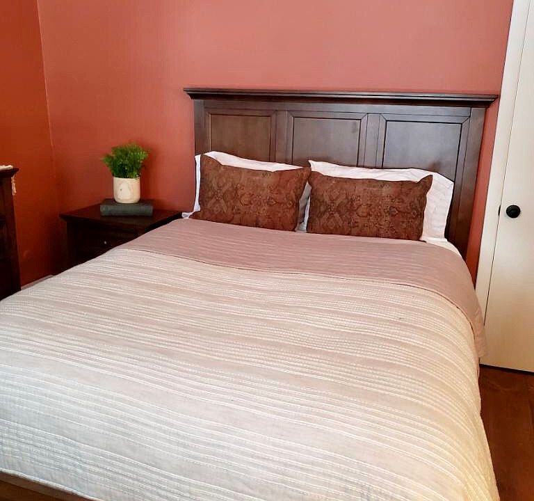 Walls are now painted yellow in this bedroom.