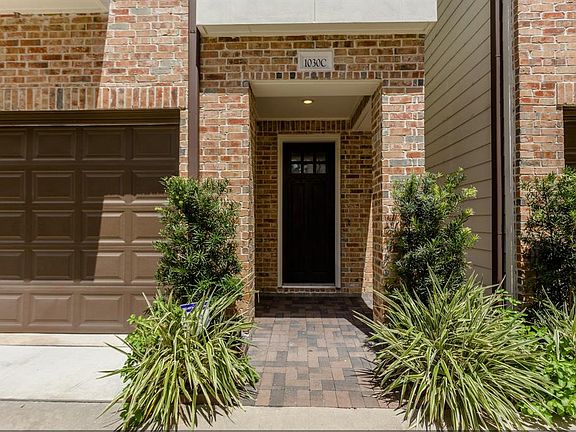 Covered front porch and two-car garage.