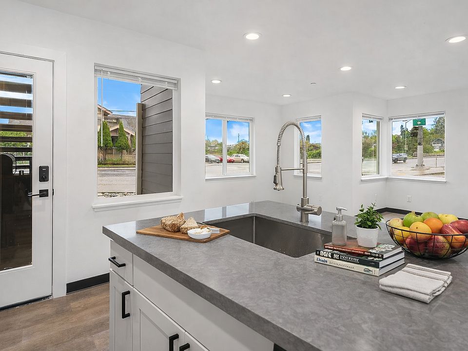 Kitchen comes furnished with barstools, pots, pans, cups, glasses, plated, utensils, small appliances, etc.