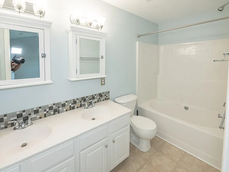 Garden tub with dual vanities in the master