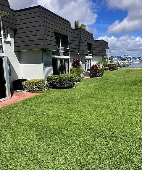 Well-maintained second-floor condo with a screened porch offering water views. It is just steps away from the dock.