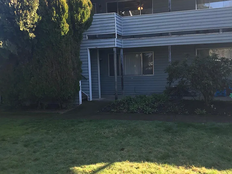 front of apartment - unit is upstairs on left - with the light on