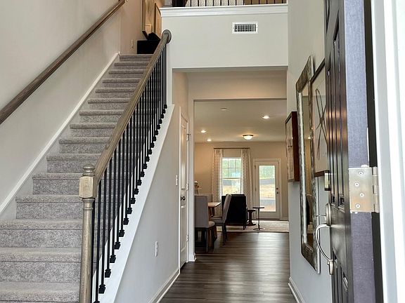 Photo from model home of same plan. Flooring and railing will be the same.