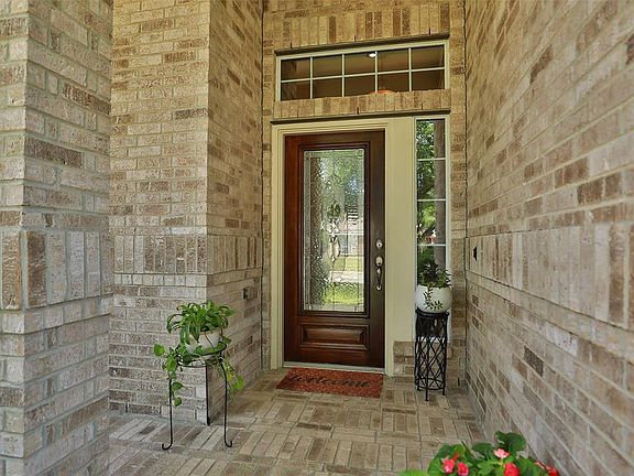 Plenty of shade prevents your mahogany door with etched glass from the blistering sun. Sidelight too!