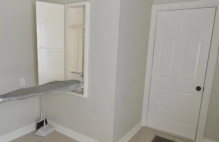 Laundry area with pull-down ironing board