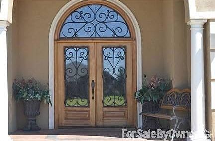 Double doors : glass, wood and rod iron
