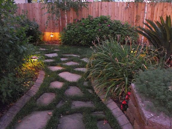 Pathway to side yard with curbing installed