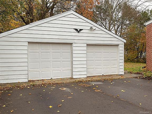 2-car garage with paved driveway and large turning area.