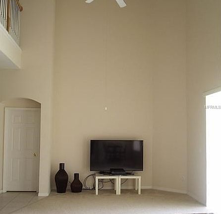 2-story high family room with sliders to the right