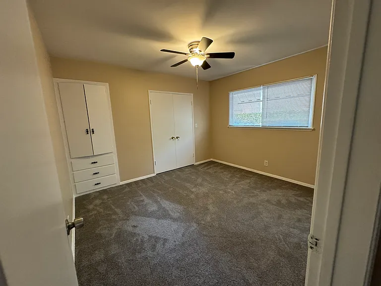 2nd bedroom. New paint, carpet and ceiling fans.