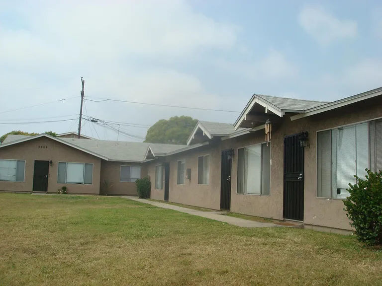 All one story living and only 6 Units with large grassy area by front door, kept clean and clipped by private Landscaping company.
