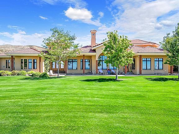 front of house with huge landscaped front yard