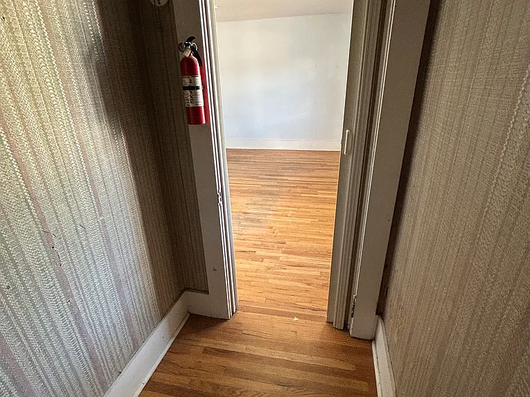POV: You're a snowboard or skis waiting for winter. From this walk-in gear cave, you can spy the cozy family room_and plot your dramatic return to the slopes. Storage with a view!