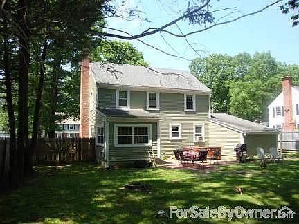 back of house w/ hot tub