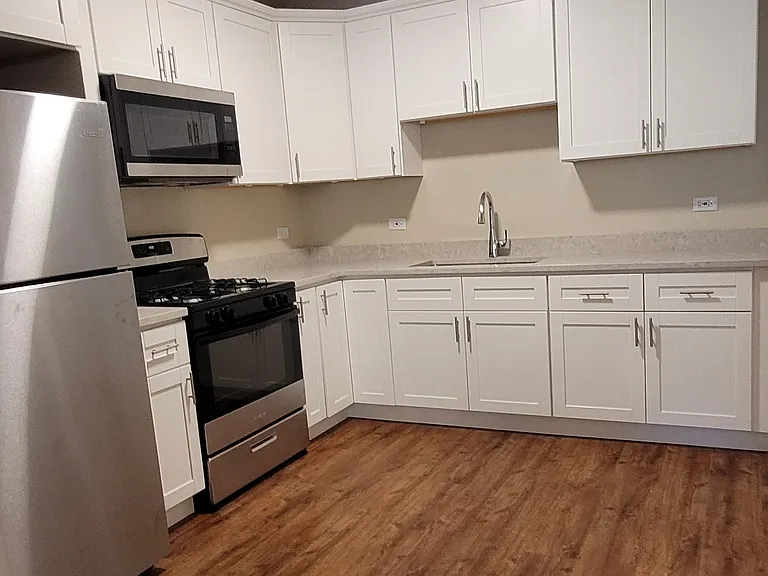 Brand new White kitchen with Stainless Steal appliances.