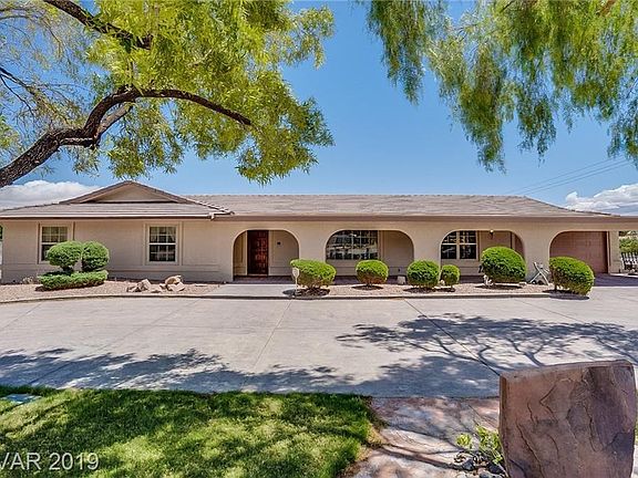 This Ranch Style 2962 sq. ft. Single Story Home with Circular Driveway Welcomes You Home.    Located with the Rural Neighborhood Preservation Area of Northwest Las Vegas.