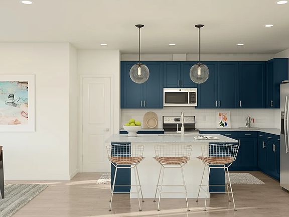 Kitchen with pendant lights center island