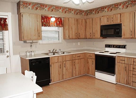 Lots of cabinets and Corian countertops