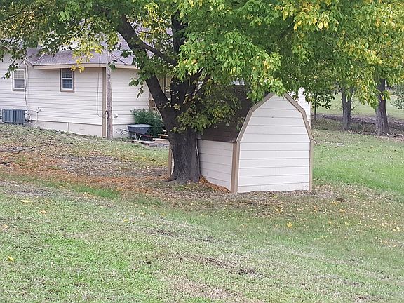 side yard with storage shed