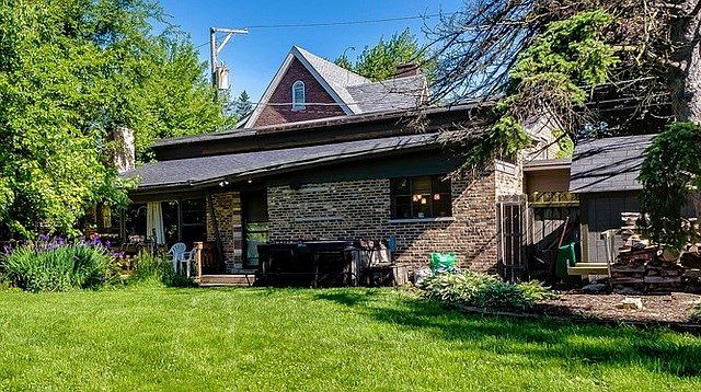 Front of home faces a huge FRONT yard with large deck and koi pond! Many possibilities here on this 75 x 150 lot!