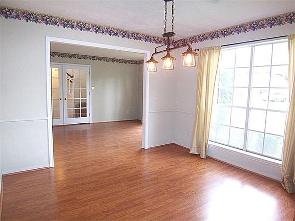 Formal dining conveniently located right off the kitchen is the perfect place for your dinner partie