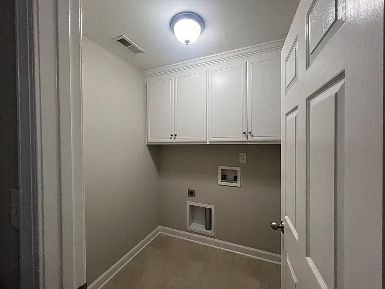 Laundry Room with storage cabinets!