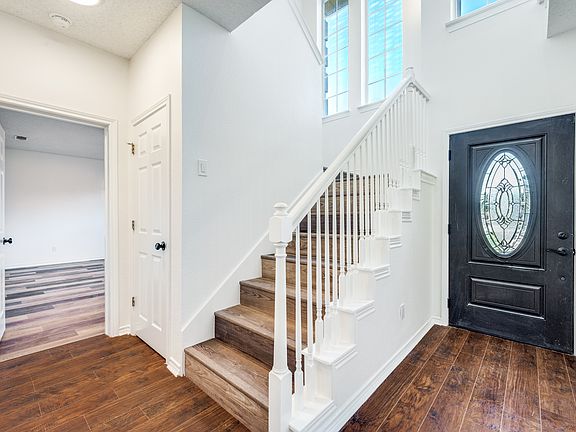 Entry. New flooring, new paint and this home has NO carpet.