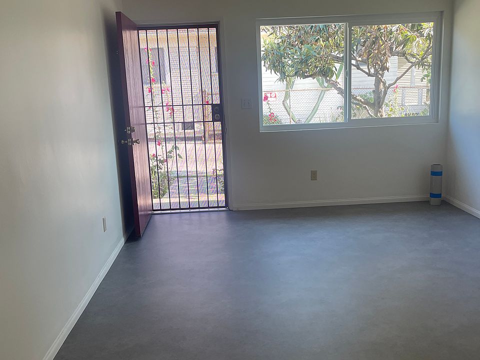 Large living area with window and door out the back