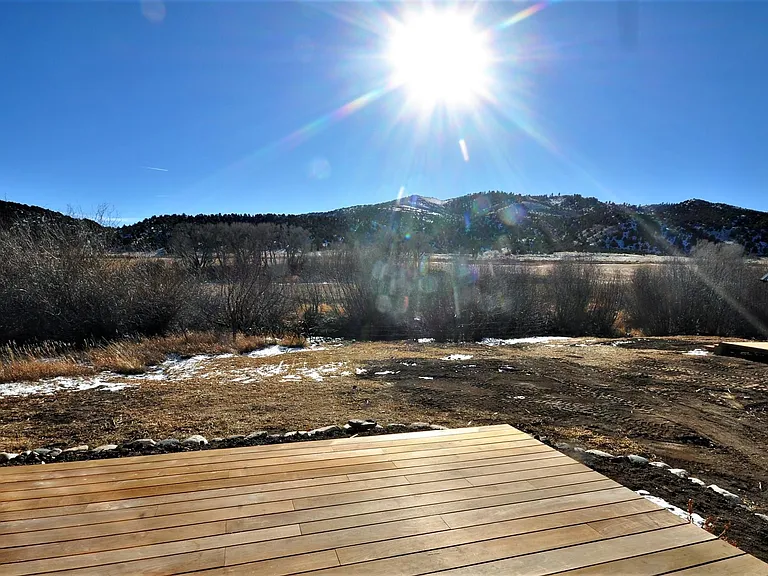 Deck only steps to the South Arkansas River with fishing access