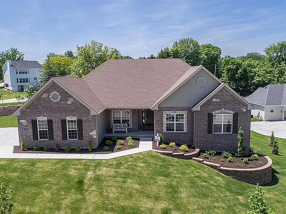 Front of home with side entry 3 car garage