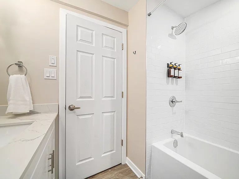 Modern shower and tub combo in the pristine bathroom of our Ottawa rental.