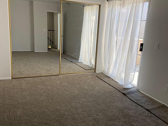 Primary Bedroom with access to balcony