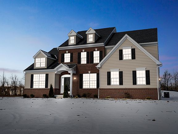 The Harrison-Side Entry Exterior Image Taken At Dusk Of A New Home From Hallmark Homes
