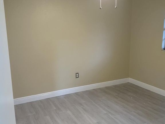 Bedroom/ office 1 New ceiling fan, paint,tile flooring and baseboard