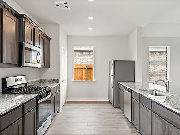 The kitchen has energy efficient appliances.