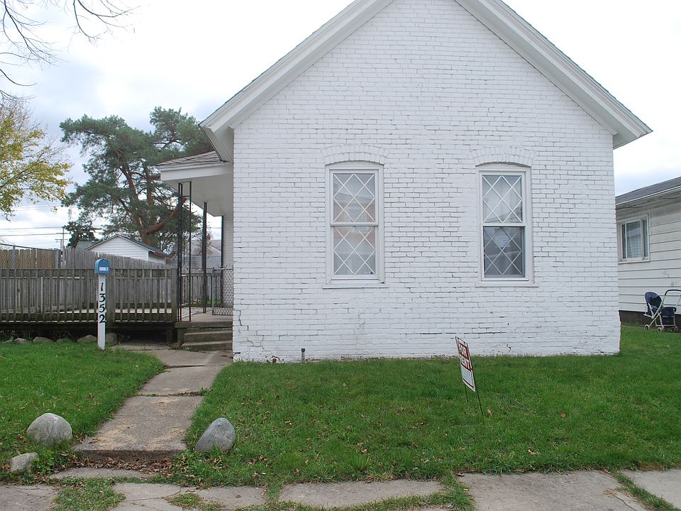 Quaint white brick home