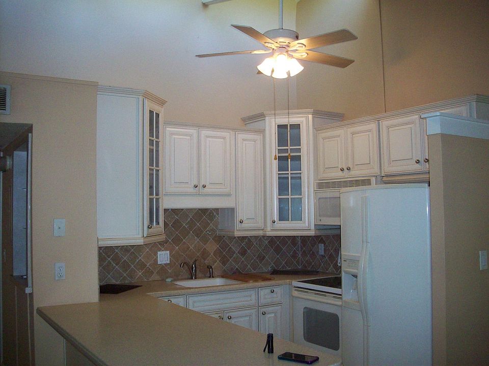 Kitchen with vaulted Ceilings and skylights.