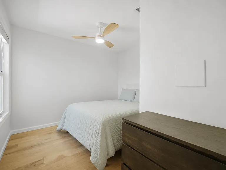 Bedroom 3 featuring a Queen-size bed.