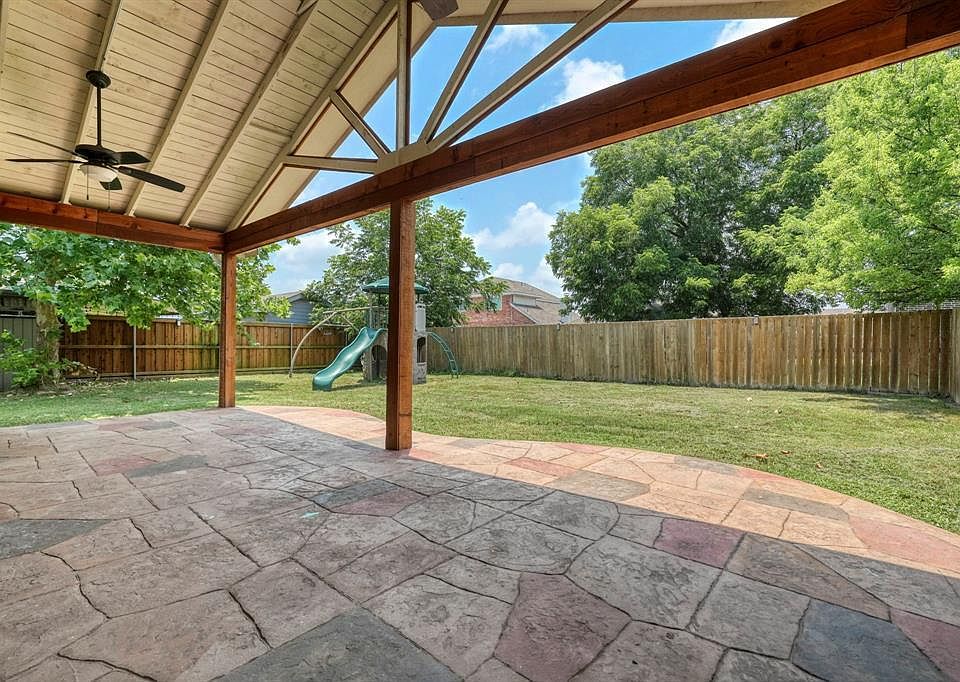 Back Patio and Yard. Note ceiling fans.