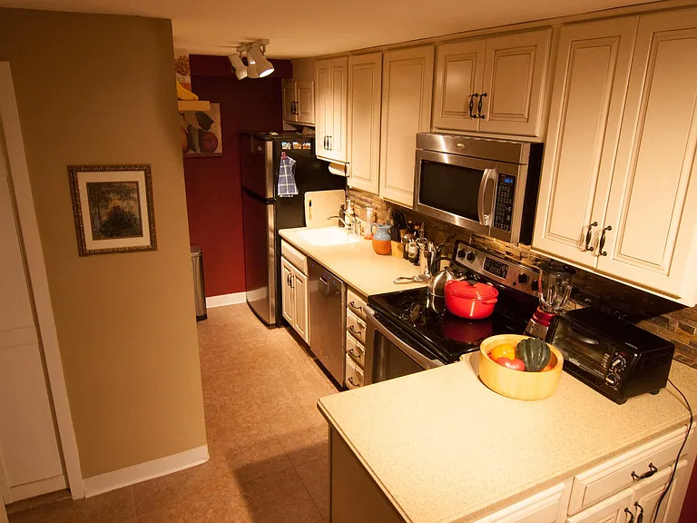 Kitchen with stainless steel appliances including refrigerator, dishwasher, stove, and microwave.