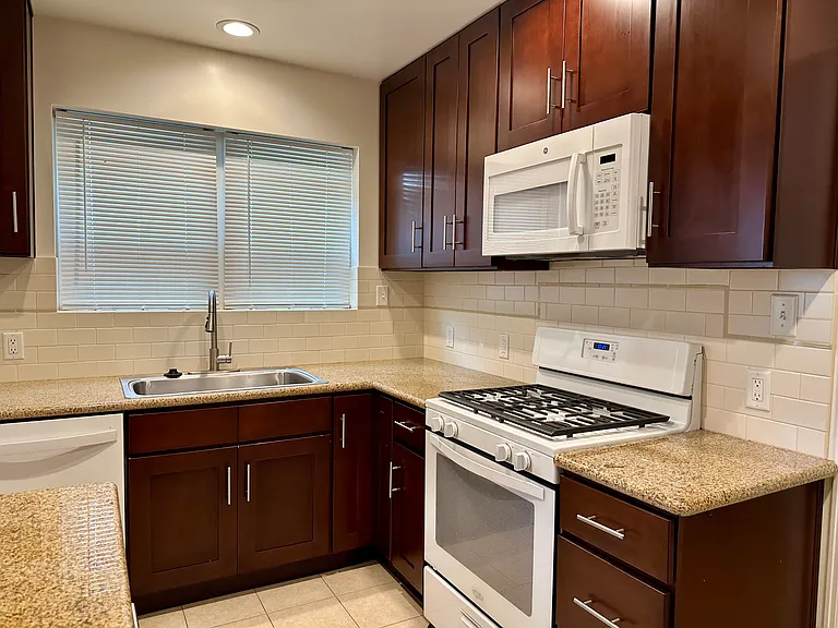 Modern stove, microwave, sink, countertop