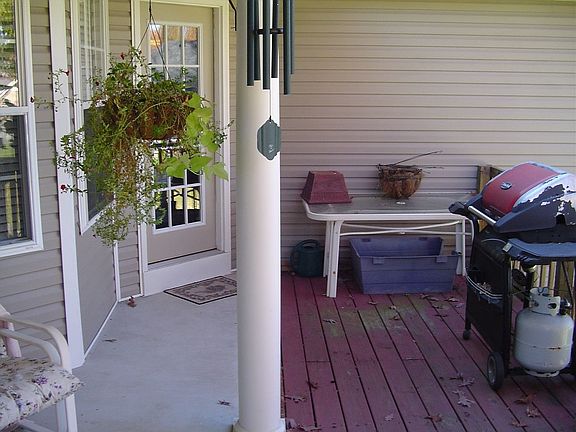 The back features a covered patio