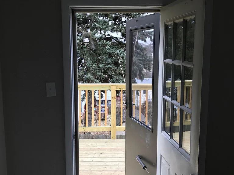 View out to deck from bedroom.
