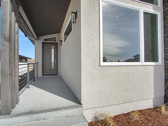 Covered Front Porch Photo representing home to be built and may demonstrate optional features