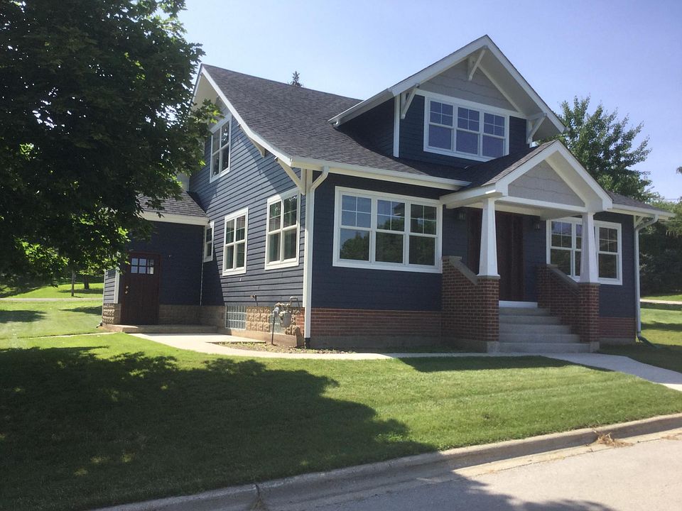 southeast corner view from road. front entry and rear entry shown