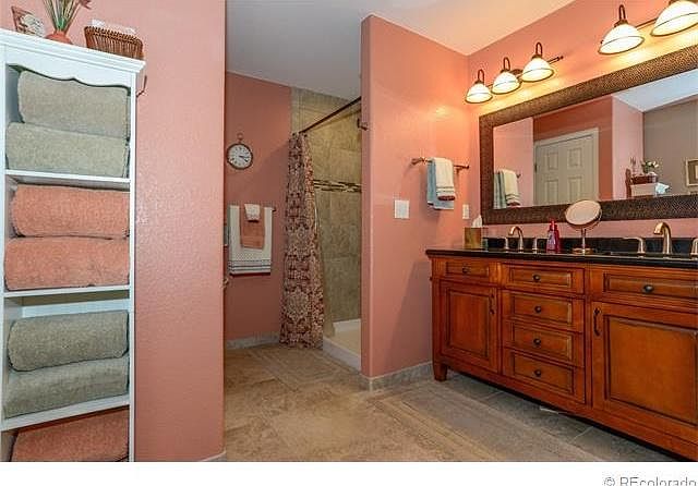 Bathroom with dual showers, and dual sinks!