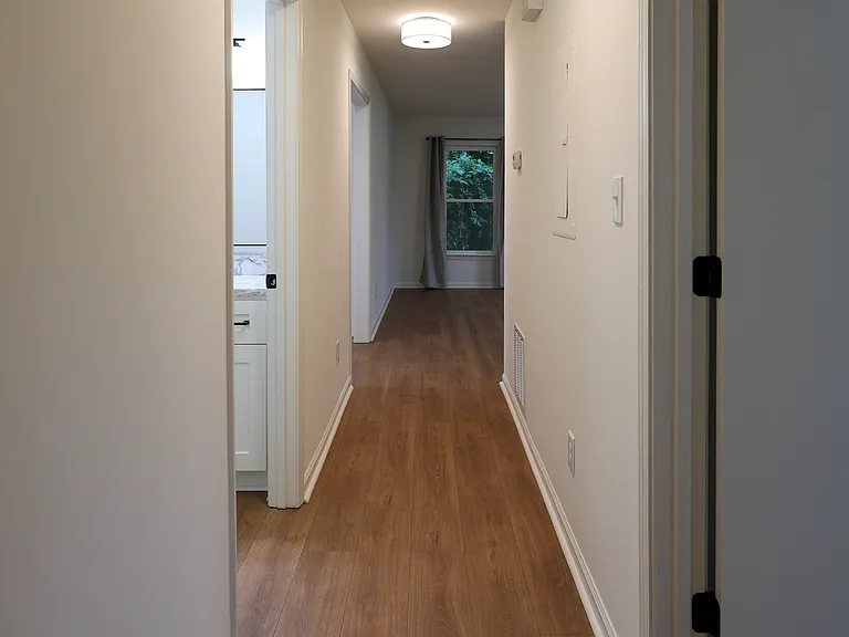Hallway from Bedrooms to Hall Bath and Living Room and Kitchen.